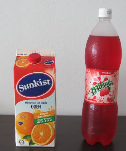 phone of orange juice and strawbery soda