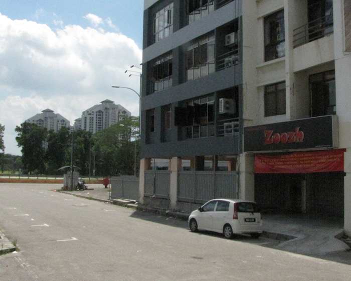 photo of Treasures and Books Store with Straits View Condos in the background