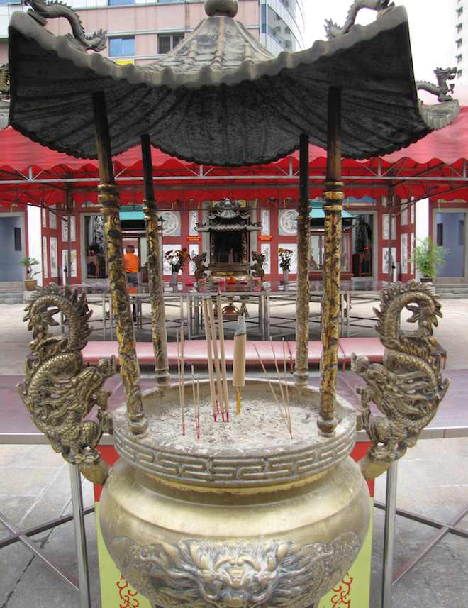 Burning offerings at the old chinese temple
