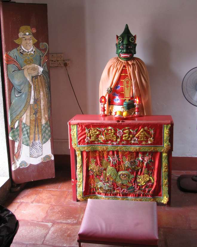 Statue of with green skin and painting at the Old Chinese Temple