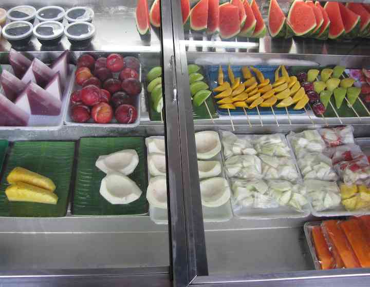 photo of prepared fresh fruit including papaya, watermelon and mango.
