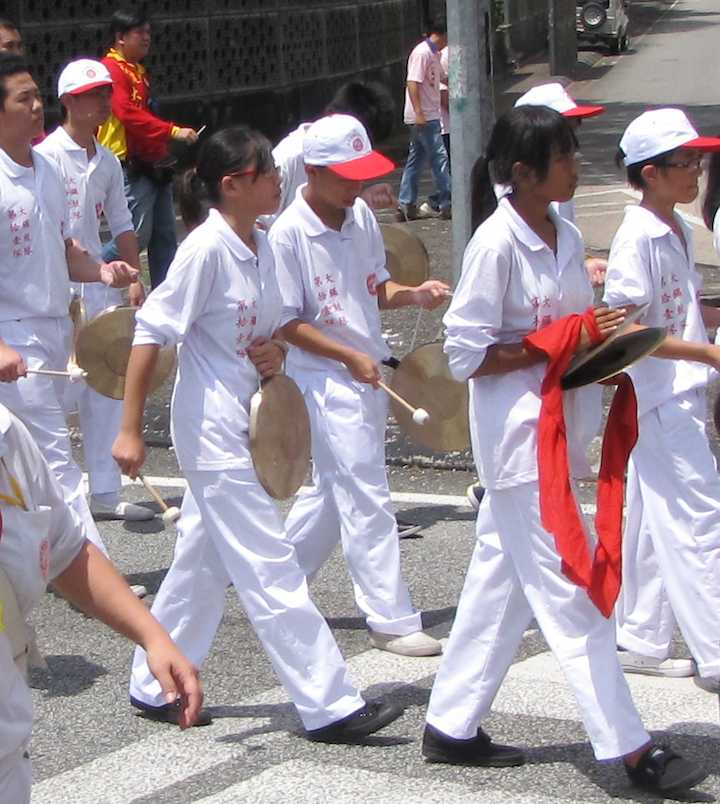 Photo of kids playing gongs at the Chingay Parade in Johor Bahru
