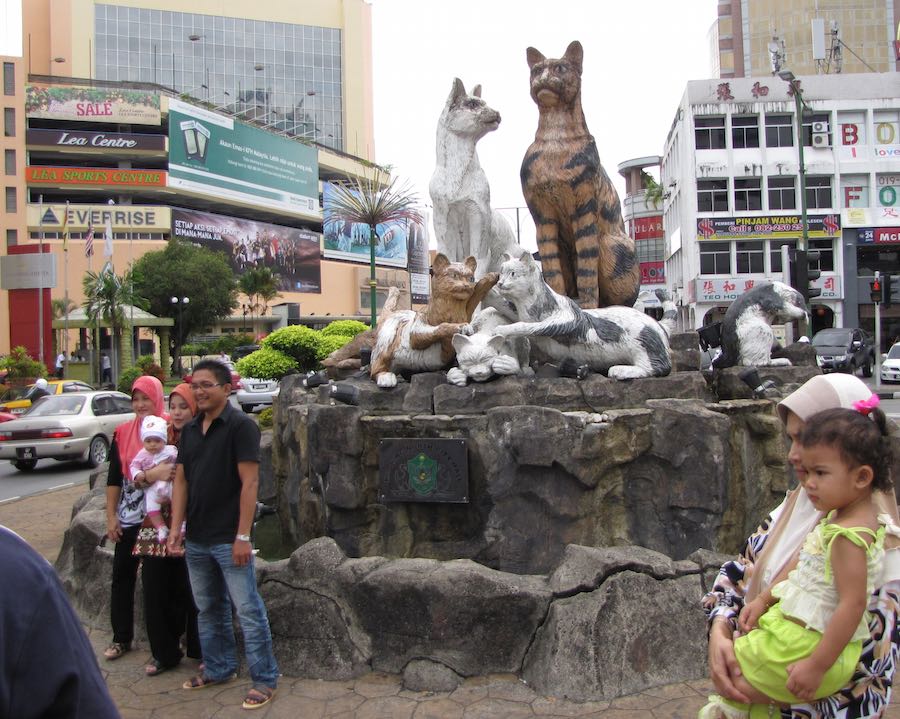 Cat monument, with people posing in front
